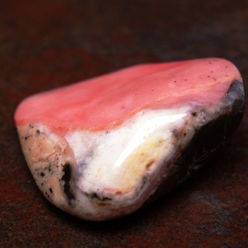 Polished Rhodochrosite crystal metaphysical properties, meanings, uses, benefits, healing energies, chakras